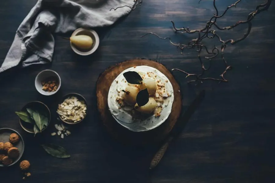 Rustic bowls on a dark wooden table set for dinner
