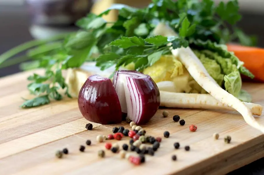 Fresh vegetables and herbs on a chopping board