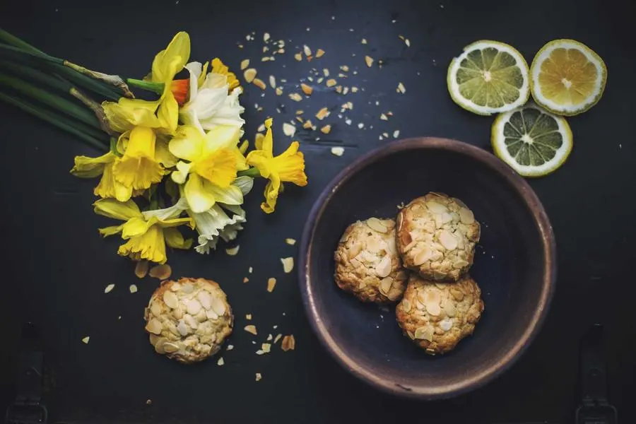 Shortbread biscuits with lime and flowers on a plate