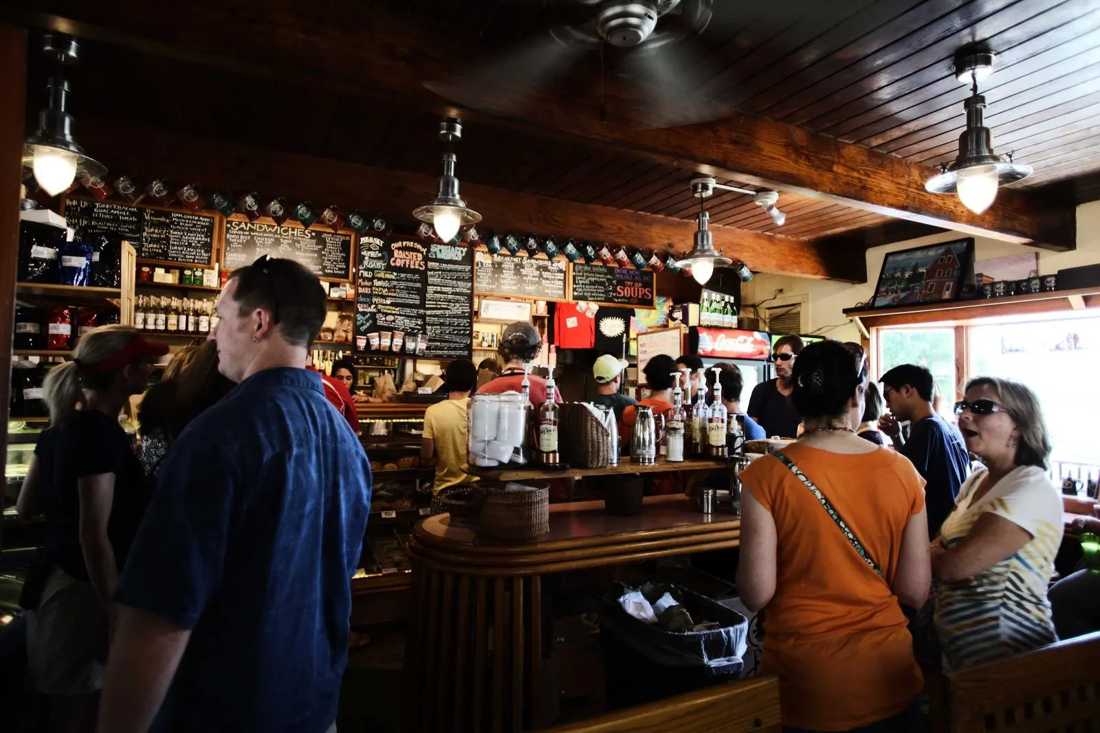 The long bar at Wren & Barrel on a busy evening