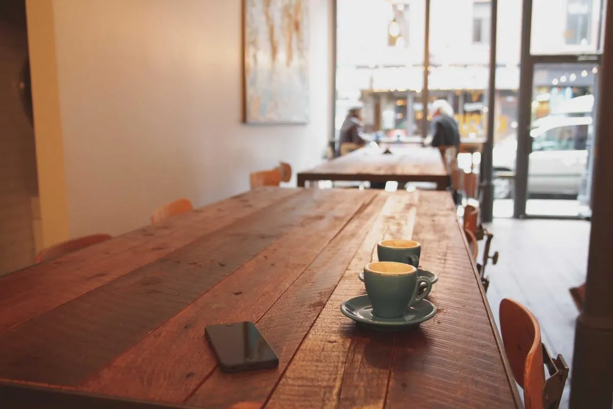 The dining room, warm light on wooden tables